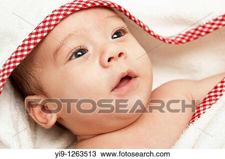 A baby wrapped in a bath towel View Large Photo Image Stock Image - A baby wrapped in a bath towel. Fotosearch