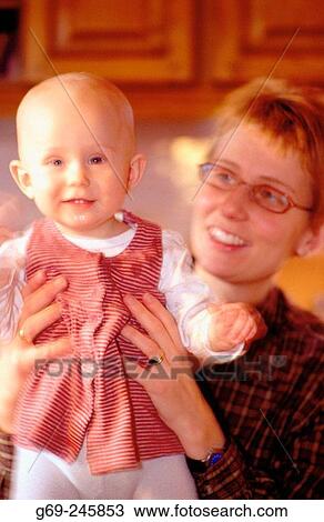 A babygirl with her mother. Medle. Vasterbotten. Sweden View Large Photo Image Stock Image - A babygirl with her mother. Medle. Vasterbotten. Sweden. Fotosearch