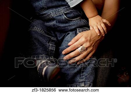 A baby's hand grasping the hand of his mother View Large Photo Image Stock Photograph - A baby's hand grasping the hand of his mother. Fotosearch