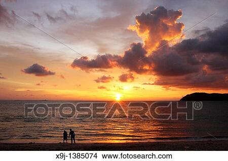 A beach at sundown with Pantai Cenang of the island Langkawi in Malaysia in southeast Asia. View Large Photo Image Picture - A beach at sundown with Pantai Cenang of the island Langkawi in Malaysia in southeast Asia.. Fotosearch