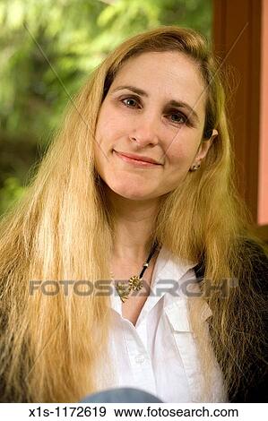 A beautiful woman with very long blonde hair posing outside View Large Photo Image Stock Photo - A beautiful woman with very long blonde hair posing outside. Fotosearch