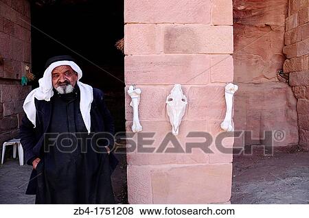 A beduin man selling animal bones in the Royal Tombs, Archaeological site, UNESCO World Heritage Site, Petra, Jordan, Middle East. View Large Photo Image Stock Photo - A beduin man selling animal bones in the Royal Tombs, Archaeological site, UNESCO World Heritage Site, Petra, Jordan, Middle East.. Fotosearch