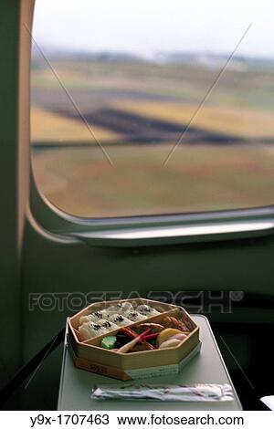 A bento box, a typical, traditional set Japanese meal, sits in the window of a Bullet Train or Shinkansen, passing from Kyoto to Tokyo View Large Photo Image Stock Image - A bento box, a typical, traditional set Japanese meal, sits in the window of a Bullet Train or Shinkansen, passing from Kyoto to Tokyo. Fotosearch