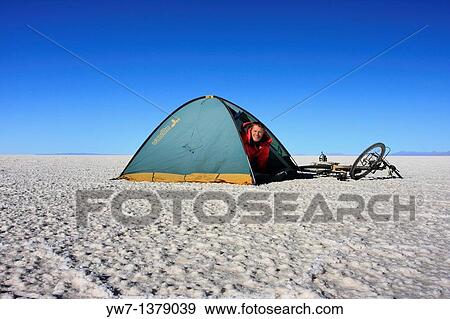 A biker in a tent on the frozen salt lake called? Salar de Uyuni? in Bolivia View Large Photo Image Stock Photo - A biker in a tent on the frozen salt lake called? Salar de Uyuni? in Bolivia. Fotosearch