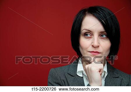 A black haired young woman contemplating. View Large Photo Image Stock Photograph - A black haired young woman contemplating.. Fotosearch