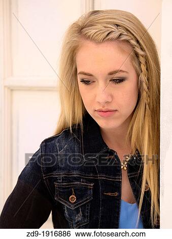 A blonde teenage girl takes on a sultry look View Large Photo Image Stock Photograph - A blonde teenage girl takes on a sultry look. Fotosearch