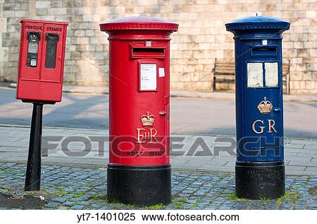 A blue Royal Mail post box George Regina next to a more common red one Elizabeth Regina in Windsor, Berkshire, UK View Large Photo Image Stock Photography - A blue Royal Mail post box George Regina next to a more common red one Elizabeth Regina in Windsor, Berkshire, UK. Fotosearch