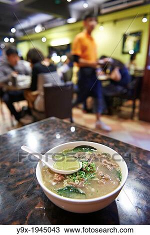 Stock Image - A bowl of clear broth beef pho Inside Thanh Ky, a vietnamese restaurant specializing in on Yongkang Street in Taipei.. Fotosearch
