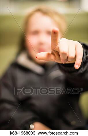 Stock Image - A boy, 10, points. Fotosearch