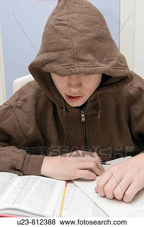A boy doing his homework. View Large Photo Image Stock Photo - A boy doing his homework.. Fotosearch