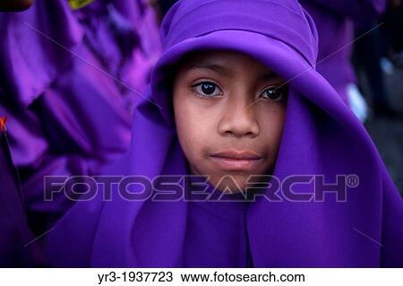 A boy dressed as a penitent participates in the Jesus Nazareno del Perdon procession during Easter Holy Week in Antigua Guatemala, Guatemala, March 28, 2013. View Large Photo Image Stock Image - A boy dressed as a penitent participates in the Jesus Nazareno del Perdon procession during Easter Holy Week in Antigua Guatemala, Guatemala, March 28, 2013.. Fotosearch