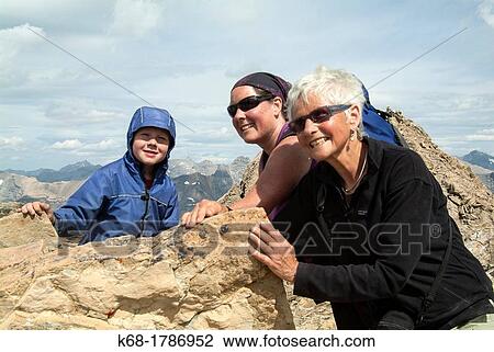 A boy, his mother and grandmother are on top of Cirque Peak in Banff National Park, Alberta, Canada View Large Photo Image Stock Image - A boy, his mother and grandmother are on top of Cirque Peak in Banff National Park, Alberta, Canada. Fotosearch