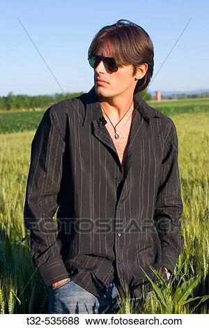 Stock Photo - A boy in a field. Fotosearch
