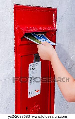 A boy of 9 posting a postcard in a Royal Mail Postbox in the Uk. View Large Photo Image Stock Image - A boy of 9 posting a postcard in a Royal Mail Postbox in the Uk.. Fotosearch