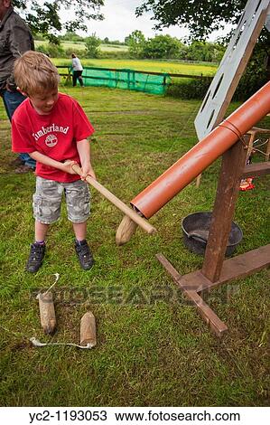 A boy playing smack the rat game at a village fete in Weston, Suffolk, England, Great Britain, Uk View Large Photo Image Stock Image - A boy playing smack the rat game at a village fete in Weston, Suffolk, England, Great Britain, Uk. Fotosearch