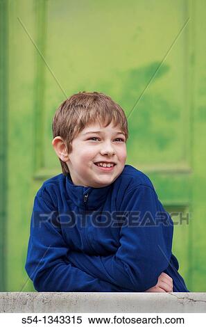 A boy smiling outdoors View Large Photo Image Stock Photography - A boy smiling outdoors. Fotosearch