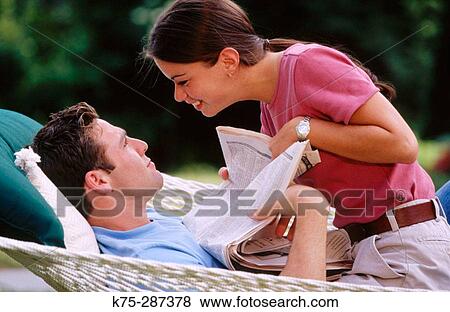 a break from reading the paper View Large Photo Image Stock Photo - a break from reading the paper. Fotosearch
