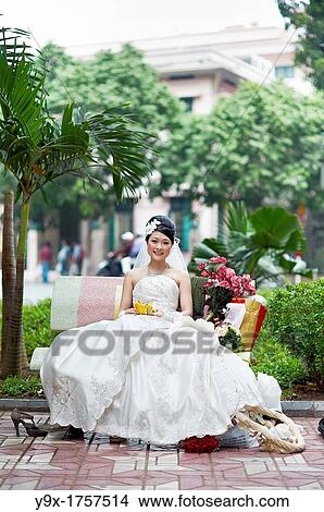 A bride and a groom at a wedding engagement photo session View Large Photo Image Picture - A bride and a groom at a wedding engagement photo session. Fotosearch