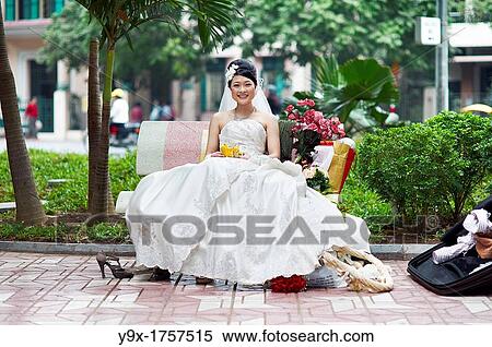 A bride and a groom at a wedding engagement photo session View Large Photo Image Stock Photography - A bride and a groom at a wedding engagement photo session. Fotosearch