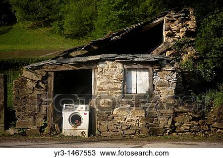 A broken washing machine blocks the door of an abandoned house located in the French Way that leads to Santiago de Compostela. View Large Photo Image Stock Image - A broken washing machine blocks the door of an abandoned house located in the French Way that leads to Santiago de Compostela.. Fotosearch