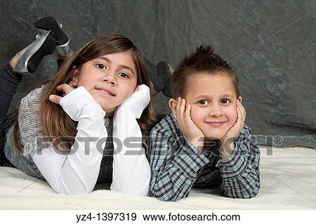 A brother and sister indoors View Large Photo Image Stock Photo - A brother and sister indoors. Fotosearch