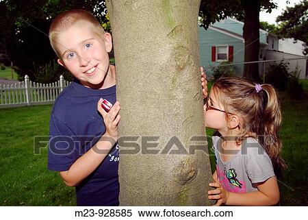 A brother and sister play by a tree, Pennsylvania, USA View Large Photo Image Stock Photography - A brother and sister play by a tree, Pennsylvania, USA. Fotosearch