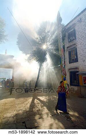 A buddhist monk walk in the smoky courtyard of the Ramoche Monastery lhasa lhasa prefecture tibet china asia View Large Photo Image Stock Image - A buddhist monk walk in the smoky courtyard of the Ramoche Monastery lhasa lhasa prefecture tibet china asia. Fotosearch