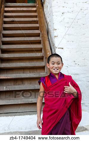 A buddhist novice monk in the stairs of Punakha Dzong, Punakha, Bhutan, Asia. View Large Photo Image Picture - A buddhist novice monk in the stairs of Punakha Dzong, Punakha, Bhutan, Asia.. Fotosearch