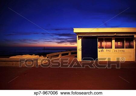A building near the sea is illuminated by the light of a candle street during sunset. Aguda, Vila Nova de Gaia, Portugal. View Large Photo Image Stock Photograph - A building near the sea is illuminated by the light of a candle street during sunset. Aguda, Vila Nova de Gaia, Portugal.. Fotosearch