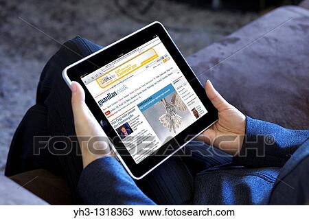 A business woman reading Guardian online news with an iPad 3G View Large Photo Image Stock Image - A business woman reading Guardian online news with an iPad 3G. Fotosearch