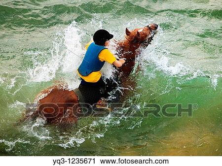 A caballo sobre las olas en la playa de Ori? n, Castro Urdiales, Cantabria View Large Photo Image Stock Image - A caballo sobre las olas en la playa de Ori? n, Castro Urdiales, Cantabria. Fotosearch