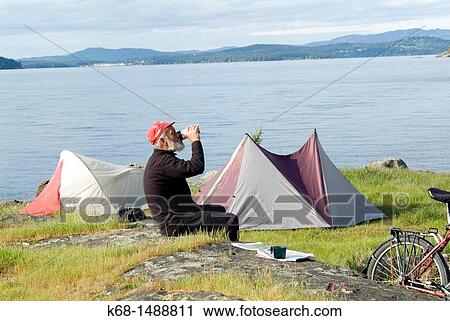 a camper, 73, relaxes with a drink at Ruckle Park campground on Saltspring Island, Gulf Islands, BC, Canada View Large Photo Image Stock Image - a camper, 73, relaxes with a drink at Ruckle Park campground on Saltspring Island, Gulf Islands, BC, Canada. Fotosearch