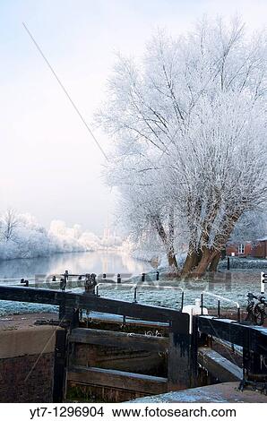 A canal lock in Worcester with a frosty river Severn in the background England View Large Photo Image Picture - A canal lock in Worcester with a frosty river Severn in the background England. Fotosearch