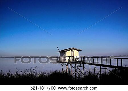 Stock Image - A? carrelet? small artisanal fishing house on the estuary of the Gironde at Blaye, Gironde, Aquitaine, France. Fotosearch