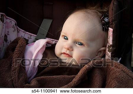 A caucasian baby girl, 6 months old, in a stroller. View Large Photo Image Stock Image - A caucasian baby girl, 6 months old, in a stroller.. Fotosearch