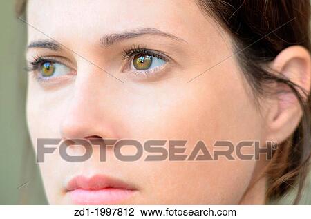 A caucasian woman with green eyes looks worried or concerned. View Large Photo Image Stock Image - A caucasian woman with green eyes looks worried or concerned.. Fotosearch