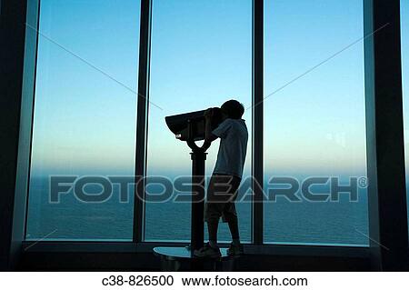 A child looks through binoculars from the top of Q1 building in Surfers Paradise, Gold Coast, Australia View Large Photo Image Stock Image - A child looks through binoculars from the top of Q1 building in Surfers Paradise, Gold Coast, Australia. Fotosearch
