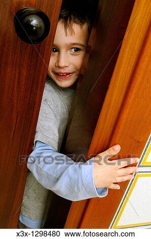 A child playing hide and seek View Large Photo Image Stock Image - A child playing hide and seek. Fotosearch