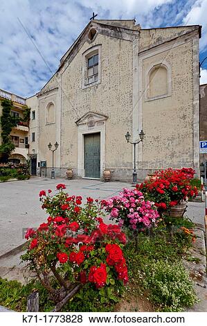 Stock Photo - A church with rose bushes in Annunziata, Campania, Italy. Fotosearch