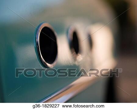 A circular metal detail glistens on a vintage car in Santa Barbara, California, United States View Large Photo Image Stock Photo - A circular metal detail glistens on a vintage car in Santa Barbara, California, United States. Fotosearch