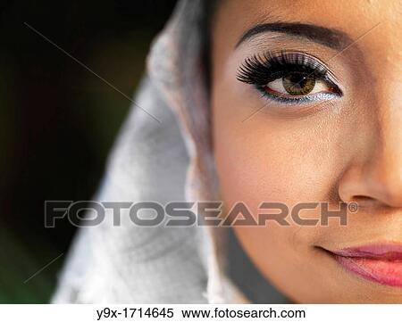A close-up of a Traditional Malaysian Dancer's face, with long lashes and stage Make-Up View Large Photo Image Stock Photography - A close-up of a Traditional Malaysian Dancer's face, with long lashes and stage Make-Up. Fotosearch