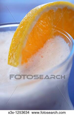 A close up of an exotic tropical fruit drink in glass View Large Photo Image Picture - A close up of an exotic tropical fruit drink in glass. Fotosearch