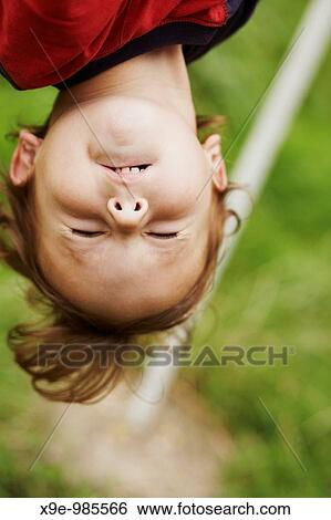 A closeup picture of the head who is hanging upside down View Large Photo Image Stock Photograph - A closeup picture of the head who is hanging upside down. Fotosearch