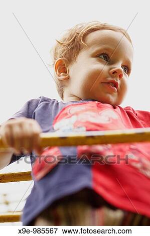 A closeup portrait of a child on the ladder View Large Photo Image Stock Photo - A closeup portrait of a child on the ladder. Fotosearch
