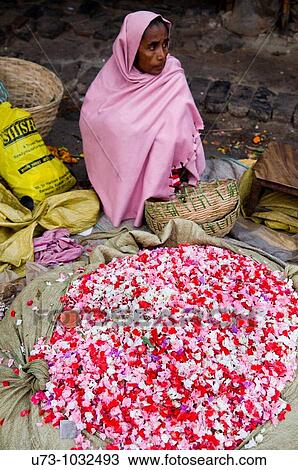 Stock Image - A colorful flower stall in the vibrant flower market of Calcutta, India.. Fotosearch
