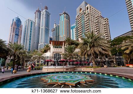 A colorful fountain in the Marina district of Dubai, UAE, Persian Gulf View Large Photo Image Stock Photo - A colorful fountain in the Marina district of Dubai, UAE, Persian Gulf. Fotosearch