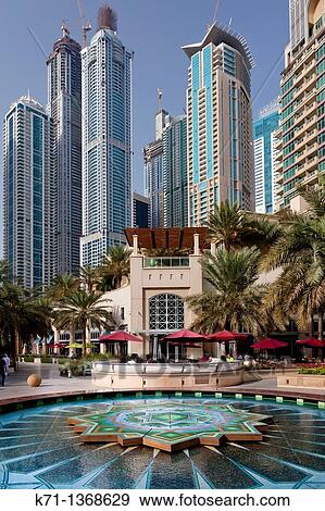 A colorful fountain in the Marina district of Dubai, UAE, Persian Gulf View Large Photo Image Stock Photo - A colorful fountain in the Marina district of Dubai, UAE, Persian Gulf. Fotosearch