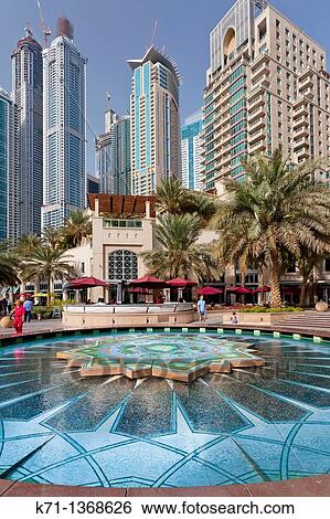 A colorful fountain in the Marina district of Dubai, UAE, Persian Gulf View Large Photo Image Stock Photograph - A colorful fountain in the Marina district of Dubai, UAE, Persian Gulf. Fotosearch