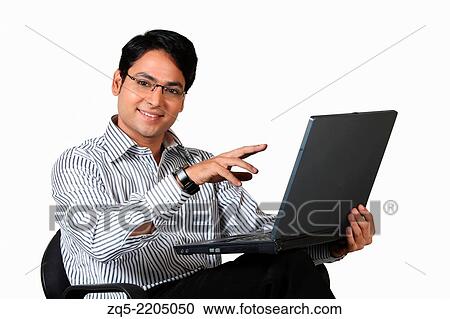 A corporate working on laptop, Pune, India. View Large Photo Image Stock Image - A corporate working on laptop, Pune, India.. Fotosearch