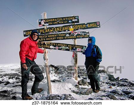 A couple at Africa's highest summit, Mount Kilimanjaro View Large Photo Image Picture - A couple at Africa's highest summit, Mount Kilimanjaro. Fotosearch